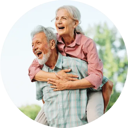Older Australian couple laughing together outdoors