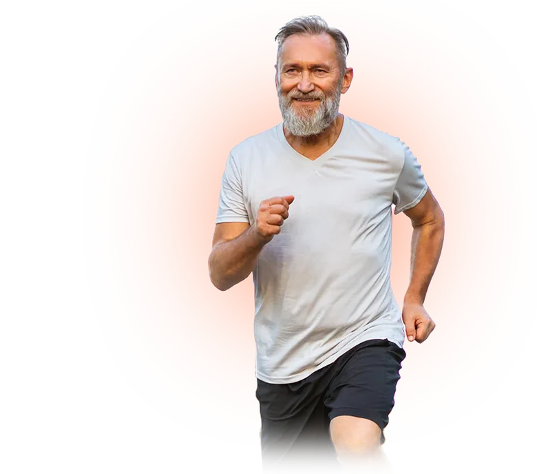 Older Australian man jogging outdoors, moving comfortably