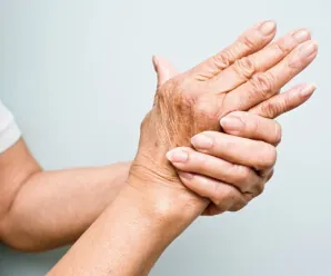Close-up of hands showing joint stiffness and discomfort